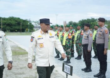 Pemkab Aceh Timur Gelar Upacara Penyerahan Satlinmas PAM TPS